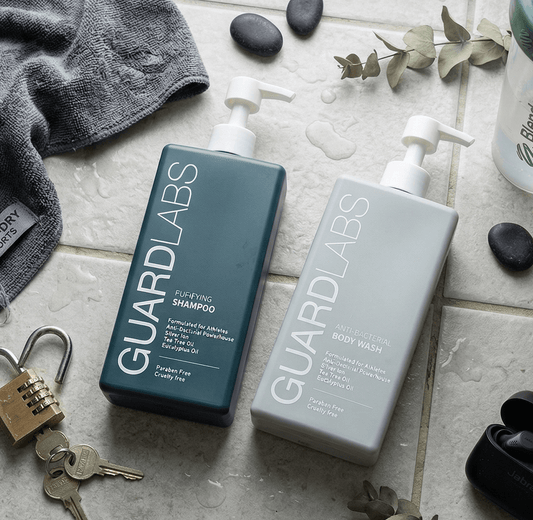 Guard Labs purifying shampoo and antibacterial body wash bundle flatlay