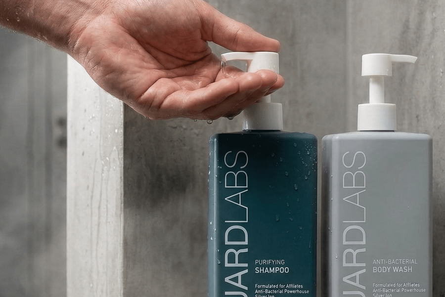 Guard Labs body wash and shampoo set displayed on shower shelf